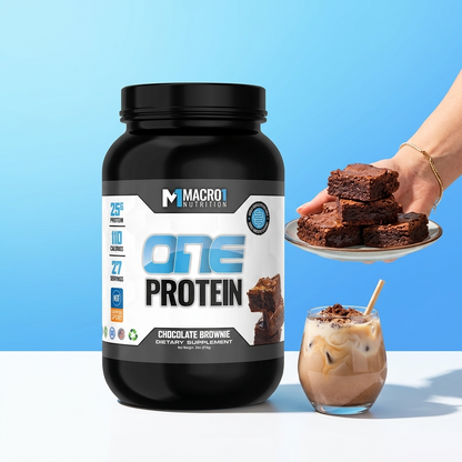 Macro1 One Protein supplement bottle with a plate of brownies and a glass of iced coffee on a blue background